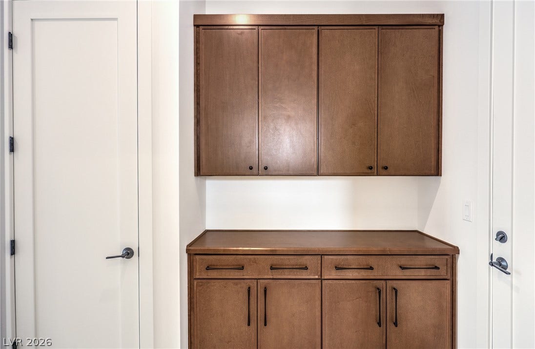 3051 E Serene Avenue, Henderson, NV 89074 A built-in cabinetry station offers practical storage options adjacent to the interior doorways.