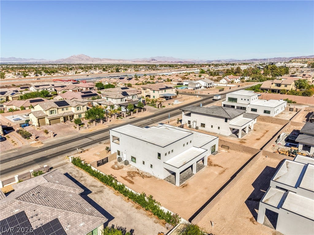 3051 E Serene Avenue, Henderson, NV 89074 Distant mountain views frame this modern residential neighborhood featuring clean architectural lines.