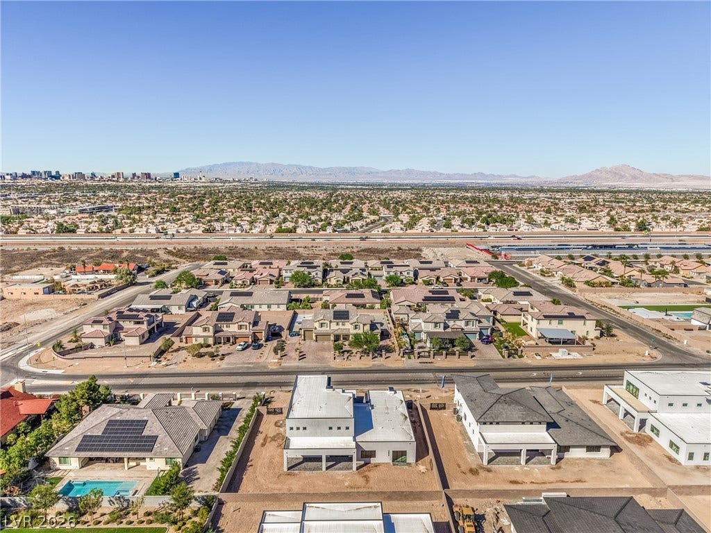 3051 E Serene Avenue, Henderson, NV 89074 Distant mountain and city skyline views frame the surrounding neighborhood from this elevated perspective.