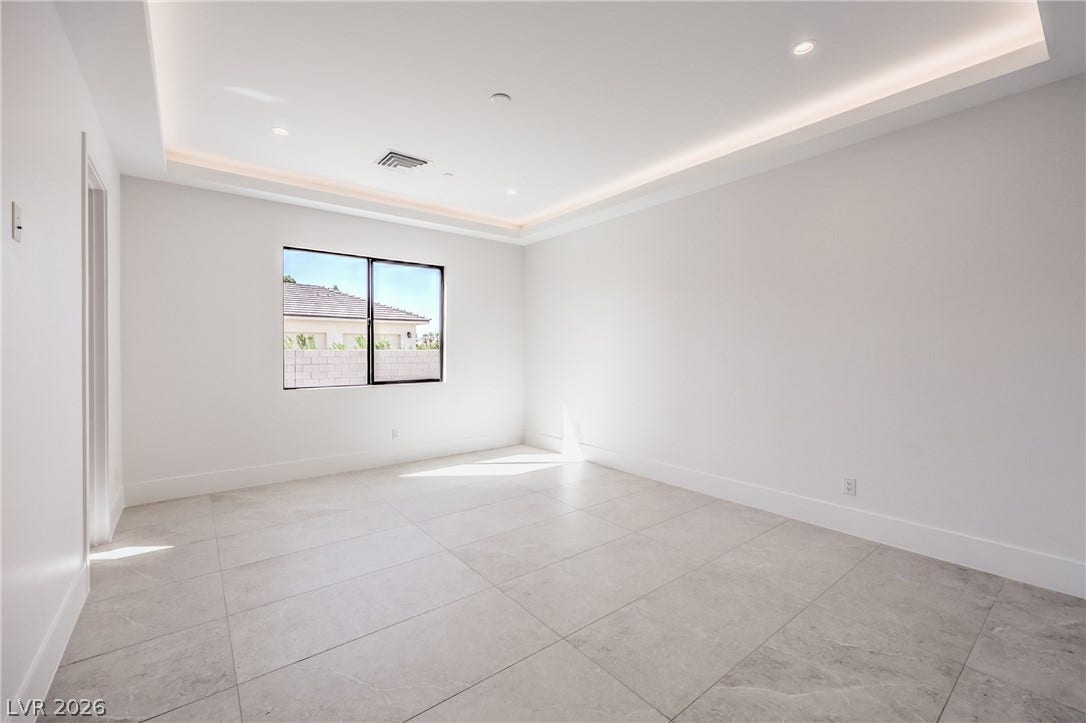 3051 E Serene Avenue, Henderson, NV 89074 Large format floor tiles and an elegant tray ceiling define this versatile space.