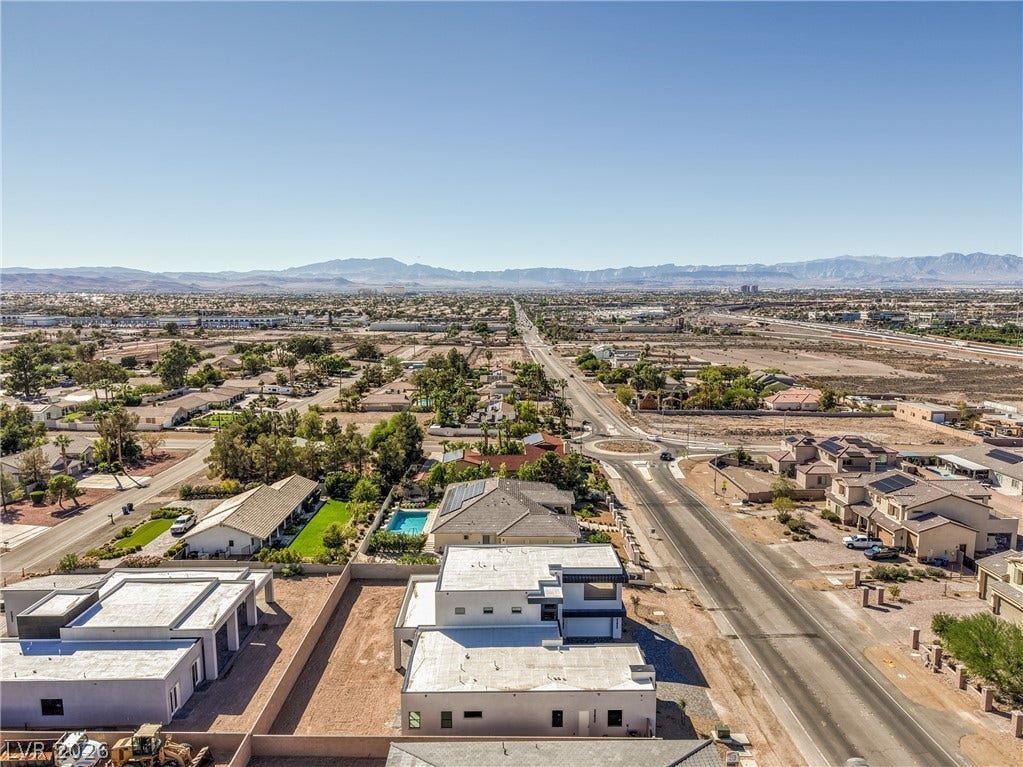 3051 E Serene Avenue, Henderson, NV 89074 An aerial perspective captures the surrounding neighborhood with distant mountain ranges framing the horizon.