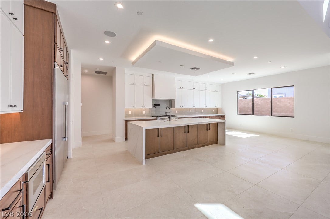 3051 E Serene Avenue, Henderson, NV 89074 An expansive kitchen layout seamlessly flows into the bright open living space.