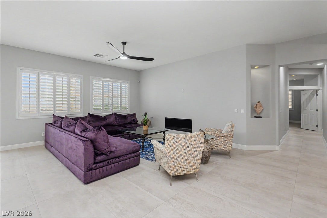 7126 Spindle Berry Street, Las Vegas, NV 89131 An open living space highlights clean modern lines and polished tile flooring.