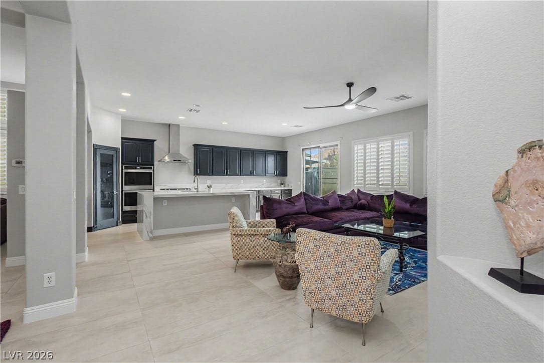 7126 Spindle Berry Street, Las Vegas, NV 89131 An open layout connects the spacious living area to a modern kitchen with tile flooring.