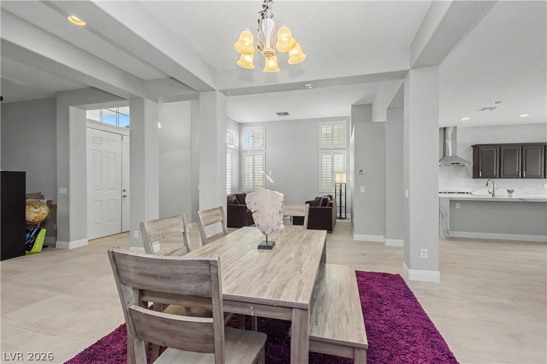7126 Spindle Berry Street, Las Vegas, NV 89131 An open floor plan connects the tiled dining area to the nearby living space.