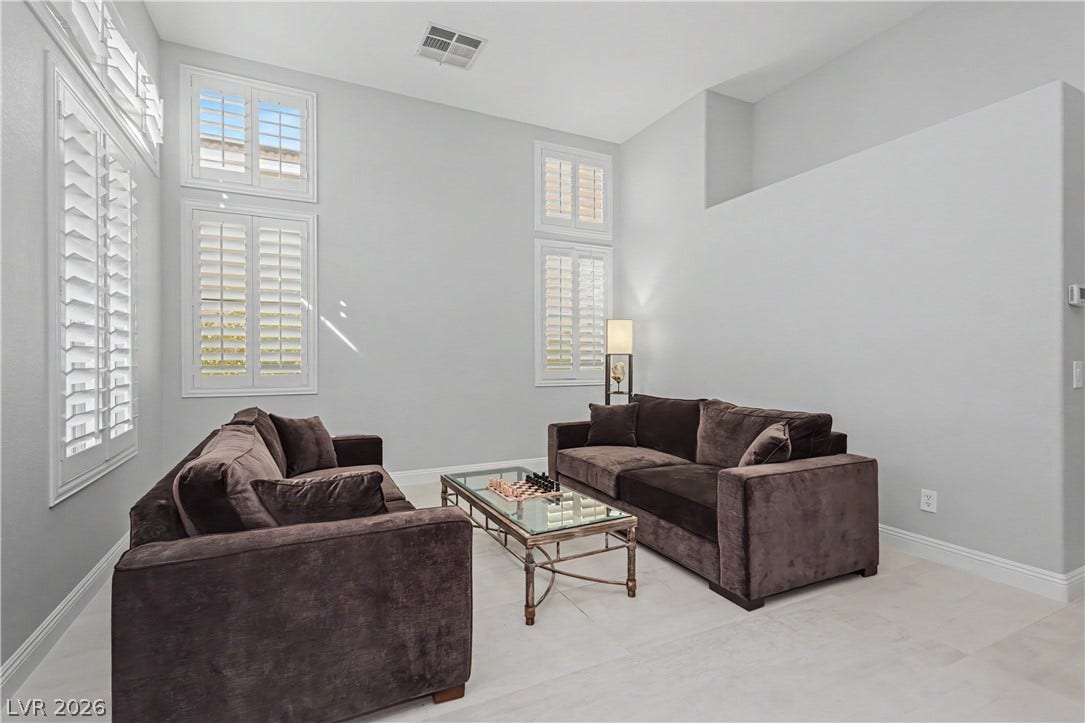 7126 Spindle Berry Street, Las Vegas, NV 89131 Towering ceilings and clean tile flooring create a spacious, light-filled atmosphere.