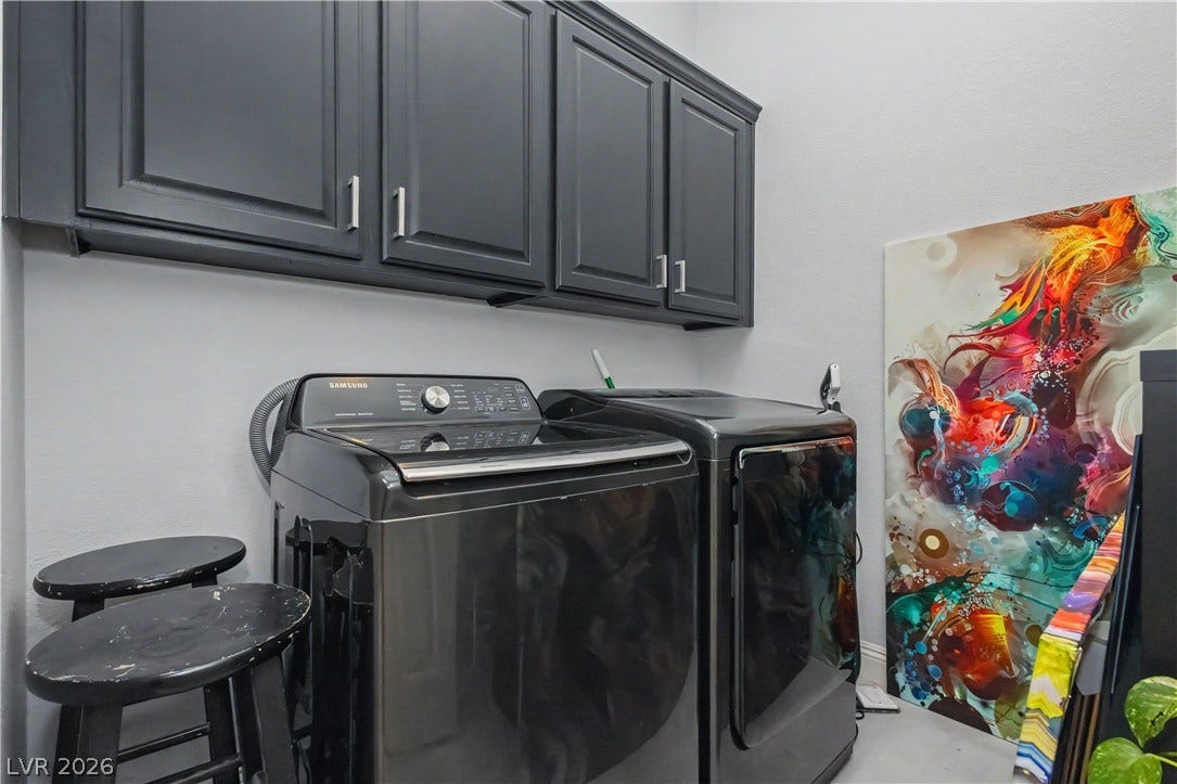 7126 Spindle Berry Street, Las Vegas, NV 89131 Ample overhead cabinetry provides abundant storage space directly above the laundry appliances.