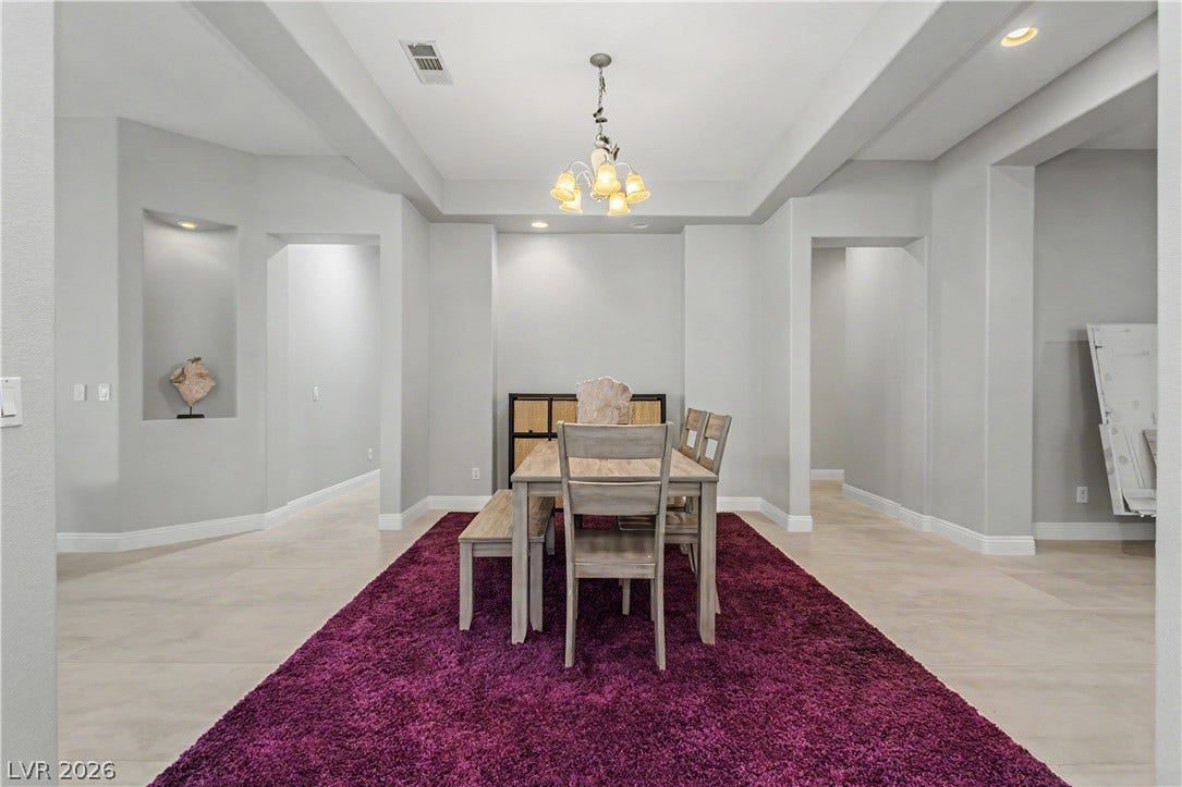 7126 Spindle Berry Street, Las Vegas, NV 89131 An elegant tray ceiling and tile flooring define this spacious formal dining area.