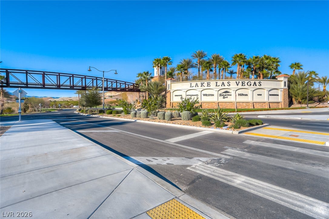 An inviting entrance monument leads into this premier resort community under clear desert skies.