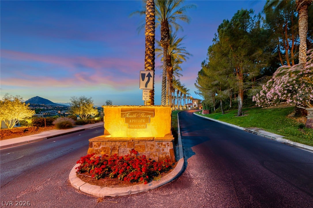 Welcoming entrance stone signage marks the secure approach to this exclusive gated enclave.