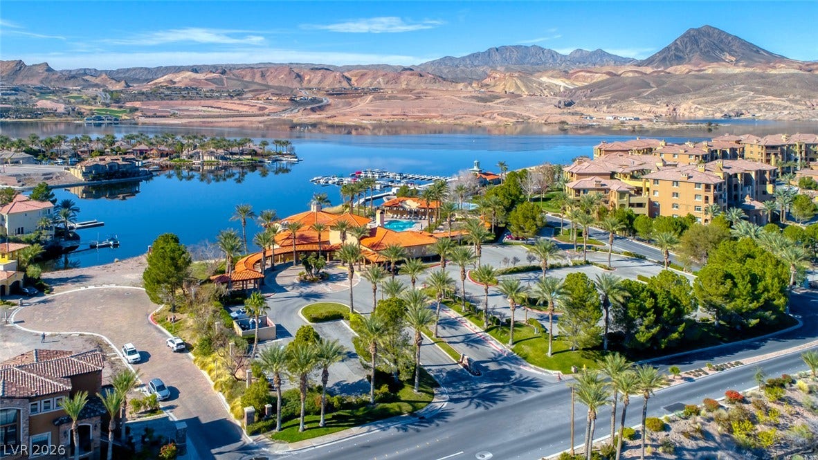 Dramatic mountain vistas frame the serene blue waters of this lakeside community.