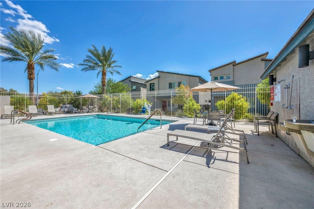 7481 Garnet Moon Street, North Las Vegas, NV 89084 An inviting swimming pool area sits surrounded by concrete decking and secure fencing.