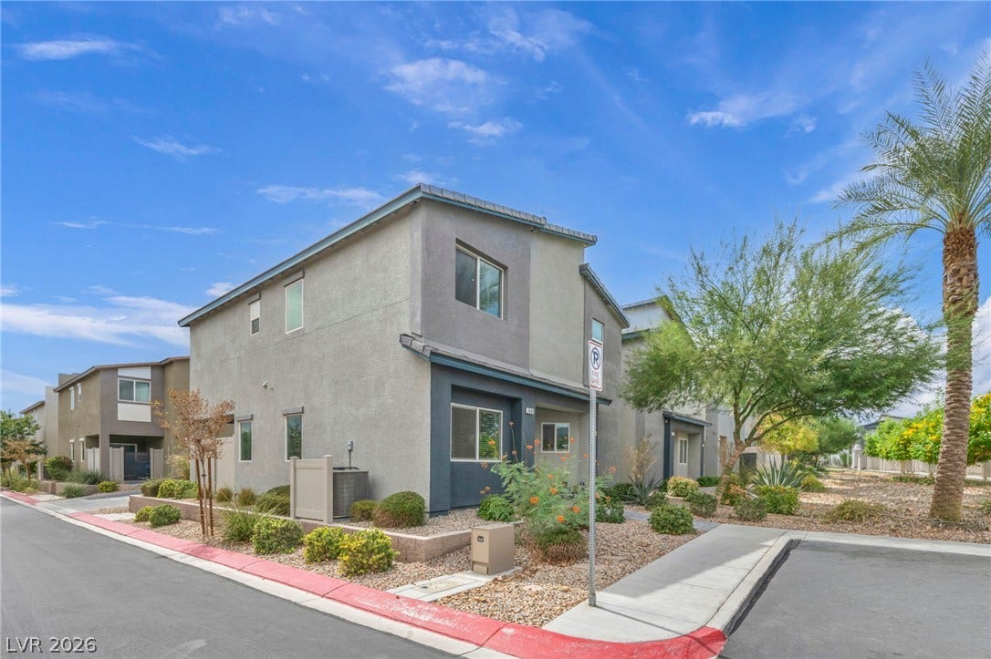 7481 Garnet Moon Street, North Las Vegas, NV 89084 A modern multi-level exterior displays clean architectural lines under a clear sky.