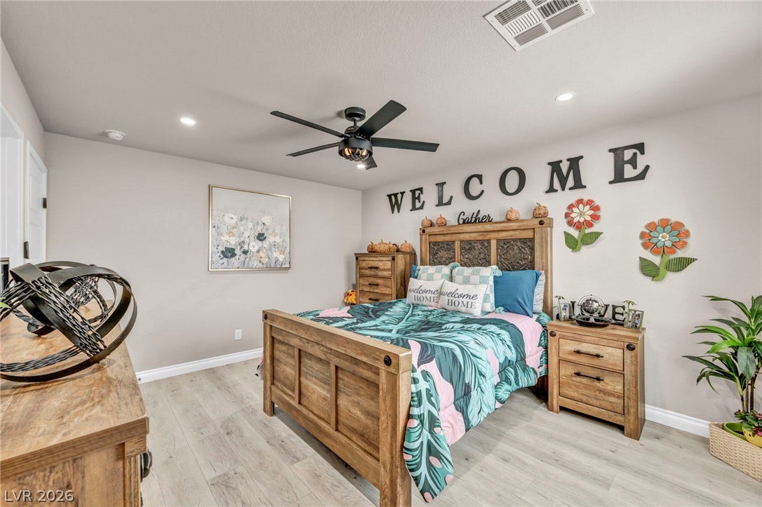 7481 Garnet Moon Street, North Las Vegas, NV 89084 Smooth wood flooring and modern recessed lighting create a comfortable, inviting atmosphere.