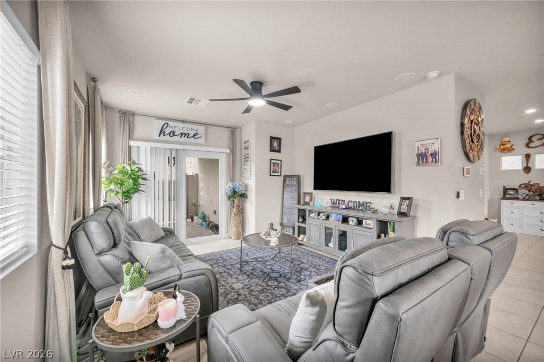 7481 Garnet Moon Street, North Las Vegas, NV 89084 An open living space connects seamlessly to the outdoors through sliding glass doors.
