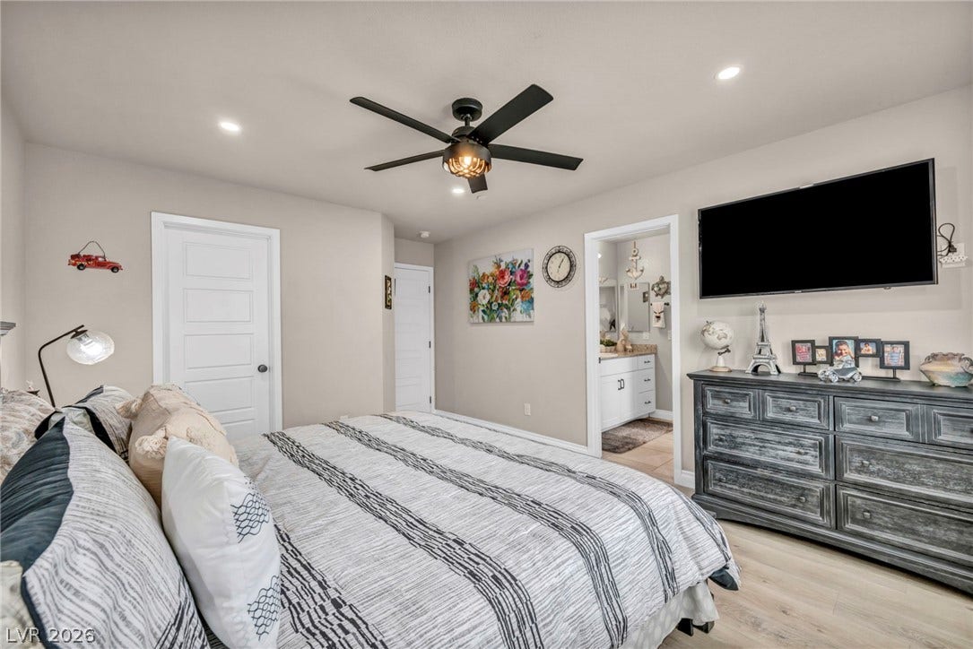 7481 Garnet Moon Street, North Las Vegas, NV 89084 Recessed lighting and wide-plank flooring define this comfortable secondary bedroom suite.