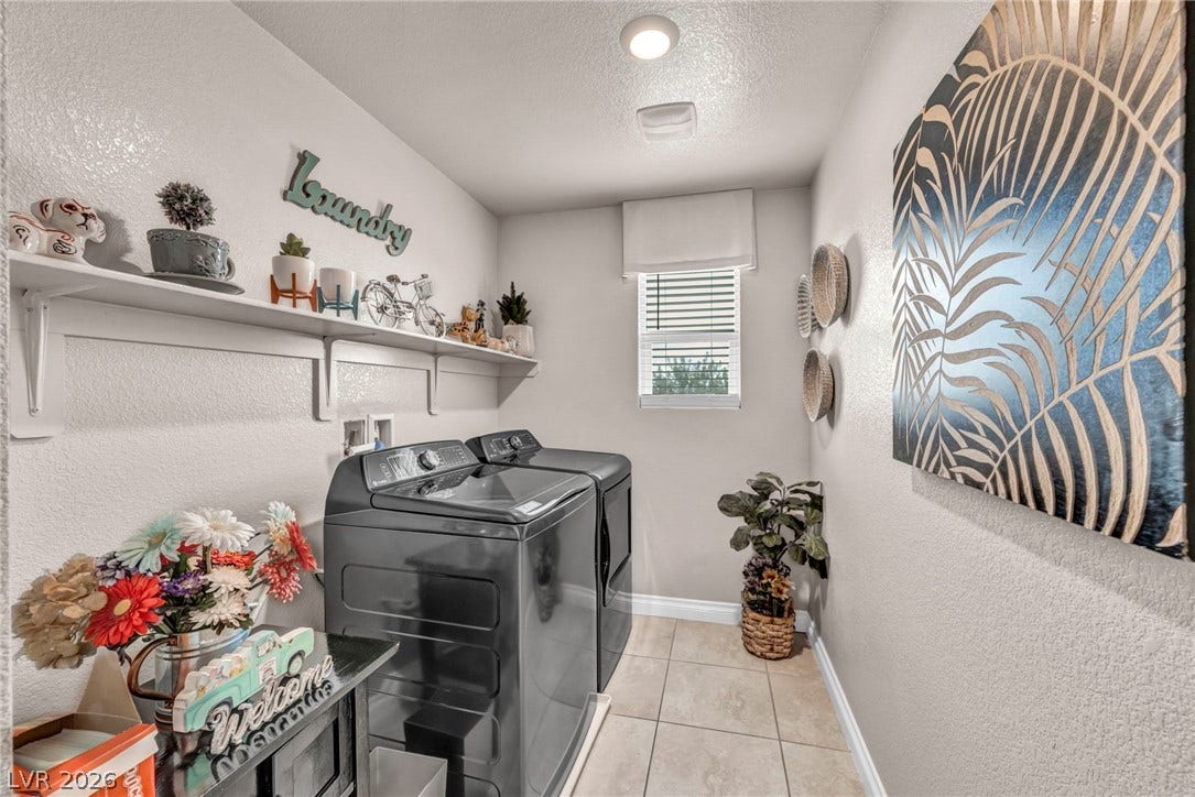 7481 Garnet Moon Street, North Las Vegas, NV 89084 Functional tile flooring and built-in shelving maximize the utility of this dedicated laundry space.