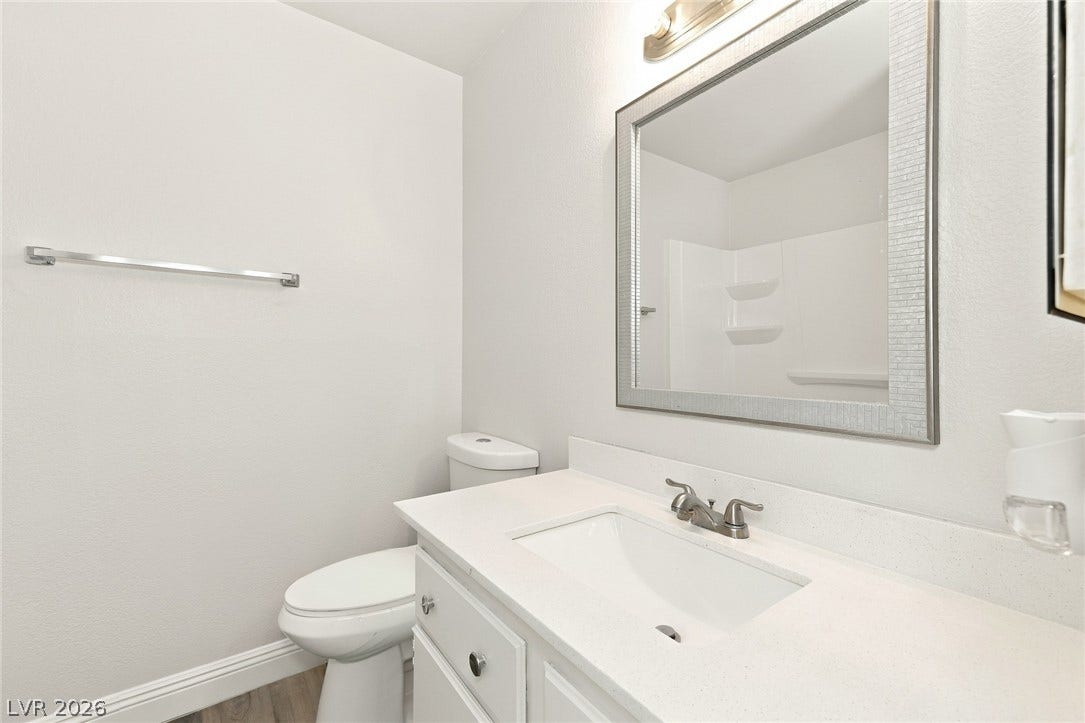 378 Tierra Street, Henderson, NV 89014 An elegant vanity and stone counter highlight this streamlined restroom space.