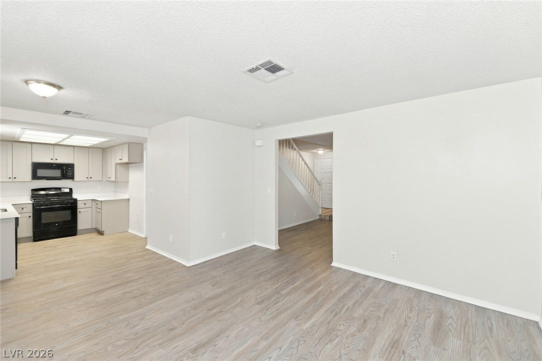 378 Tierra Street, Henderson, NV 89014 Gleaming wood-look floors anchor this airy living space opening directly into the kitchen.