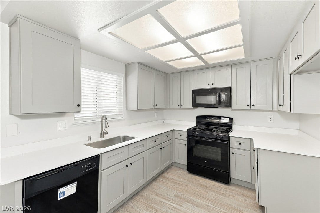 378 Tierra Street, Henderson, NV 89014 Crisp white countertops and shaker-style cabinetry define this updated workspace.
