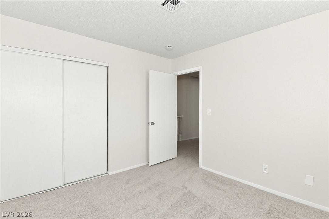 378 Tierra Street, Henderson, NV 89014 Plush carpeting and integrated sliding closet doors define this comfortable bedroom space.