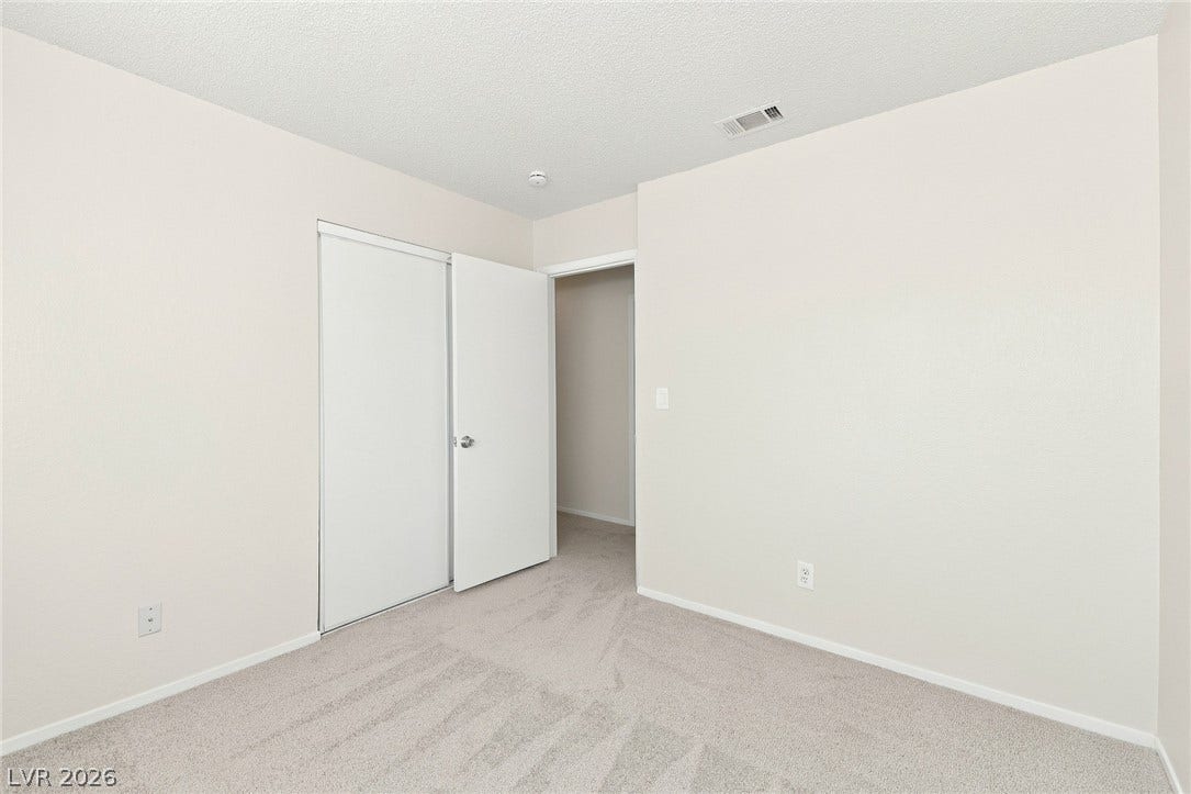 378 Tierra Street, Henderson, NV 89014 Soft carpeting pairs with neutral walls in this versatile secondary bedroom setup.