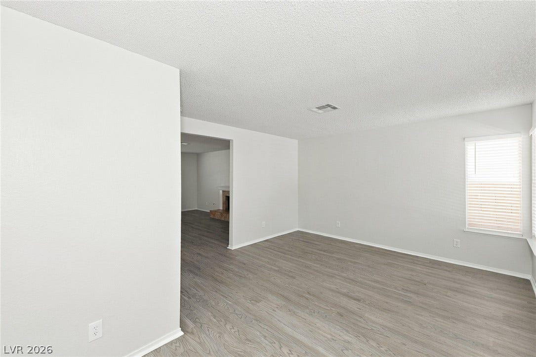 378 Tierra Street, Henderson, NV 89014 Smooth wood-look flooring and crisp white walls create a clean, contemporary living space.