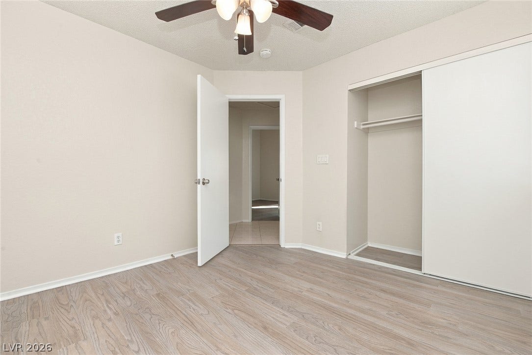 4448 Ryder Lane, North Las Vegas, NV 89031 Smooth wood-look flooring and a built-in closet define this versatile room.