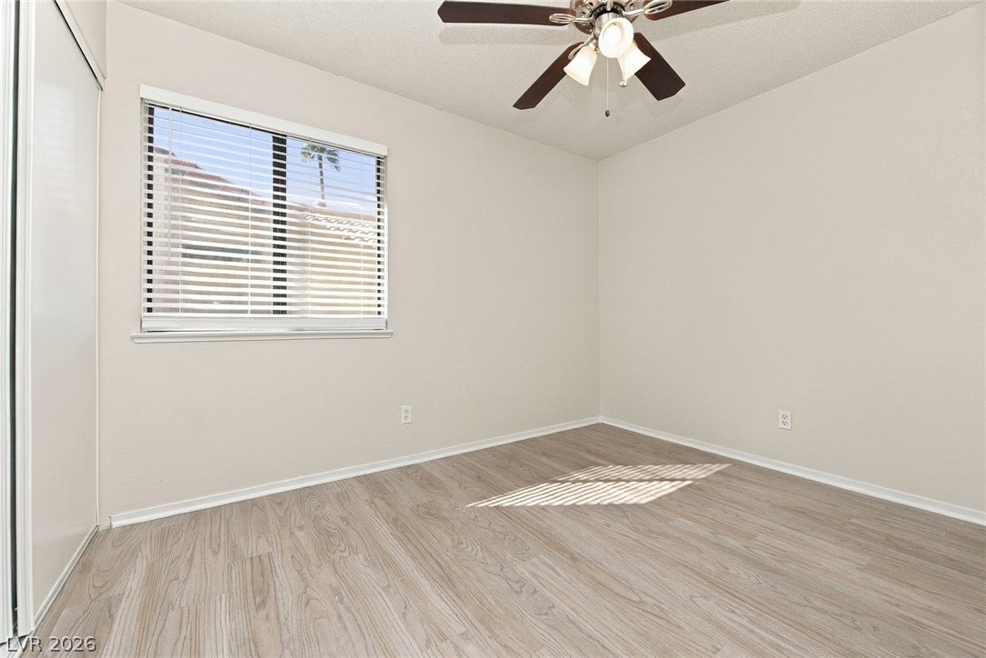 4448 Ryder Lane, North Las Vegas, NV 89031 Clean lines and durable wood-look flooring define this versatile secondary bedroom space.