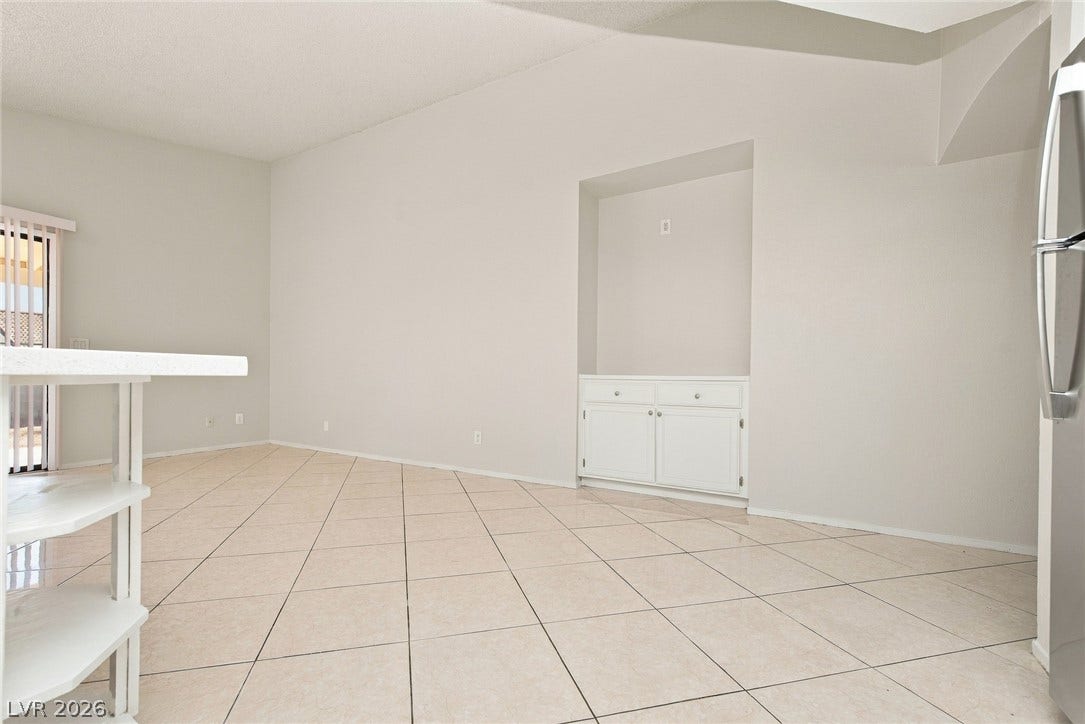 4448 Ryder Lane, North Las Vegas, NV 89031 Tiled flooring and a built-in media niche enhance this versatile open dining space.