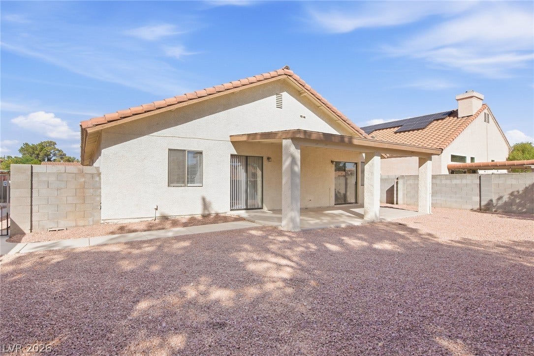 4448 Ryder Lane, North Las Vegas, NV 89031 A spacious covered patio overlooks the low-maintenance desert backyard enclosed by block fencing.