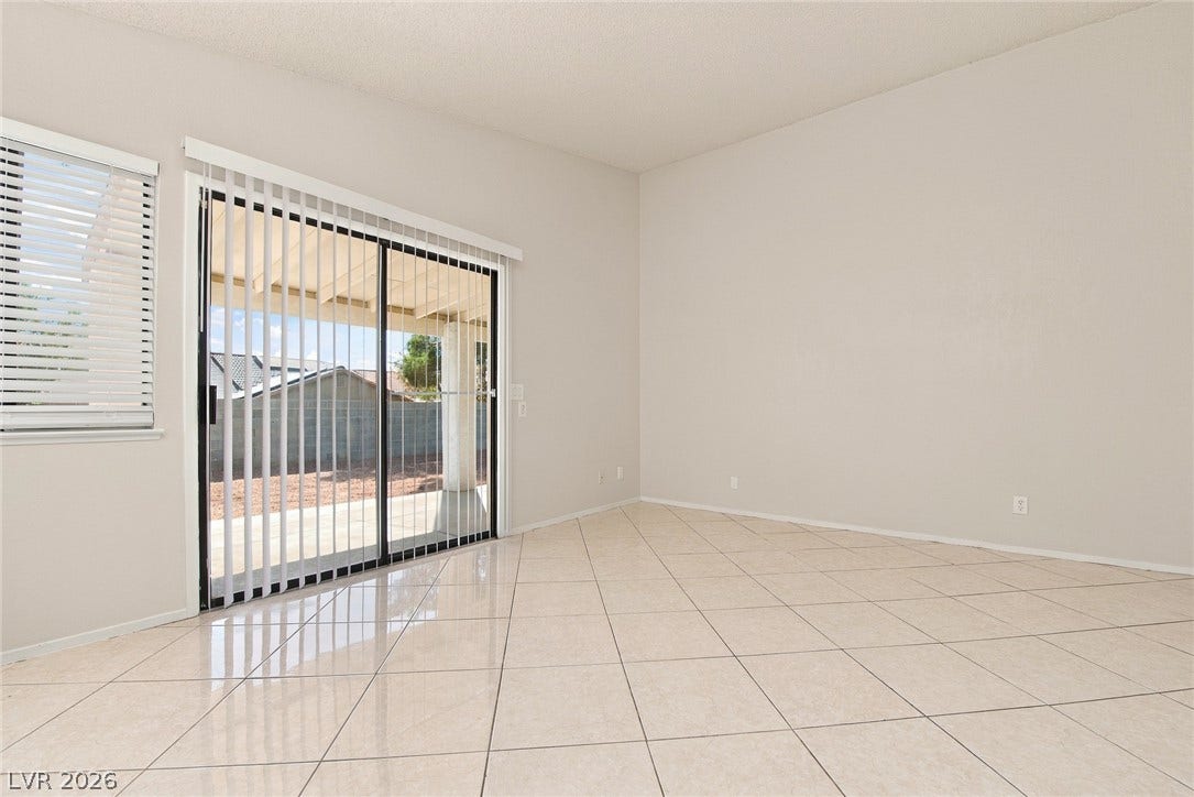 4448 Ryder Lane, North Las Vegas, NV 89031 Polished tile flooring and sliding glass doors create a seamless connection to the outdoors.
