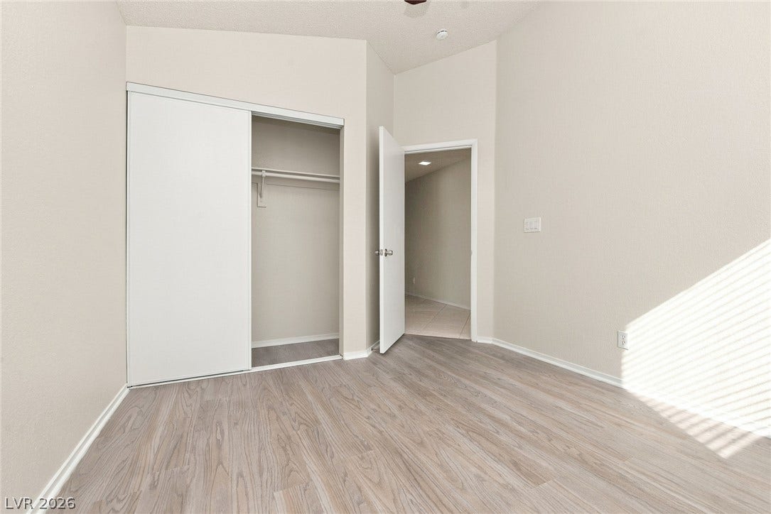 4448 Ryder Lane, North Las Vegas, NV 89031 Smooth wood-look flooring and a built-in closet define this versatile room.