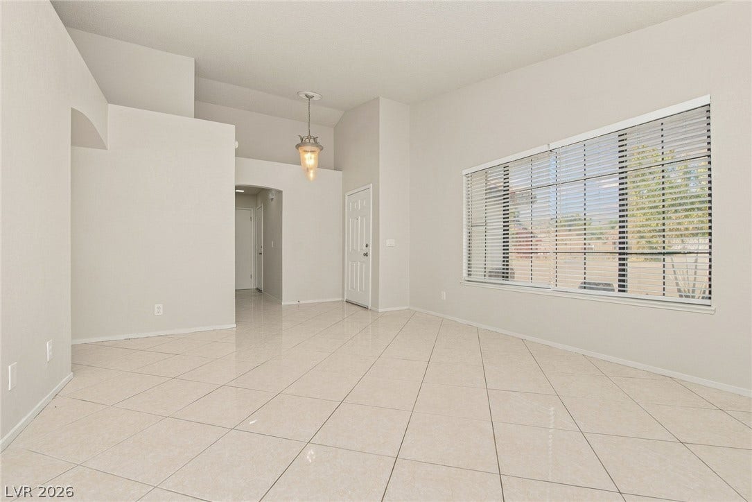 4448 Ryder Lane, North Las Vegas, NV 89031 Polished tile flooring and high ceilings define this light-filled entry space.