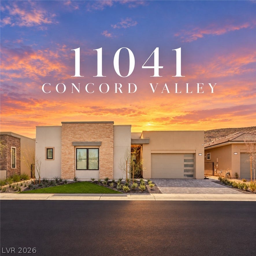11041 Concord Valley Drive, Las Vegas, NV 89135 A modern facade combines brick and stucco detailing with a clean-lined paved driveway and native landscaping.