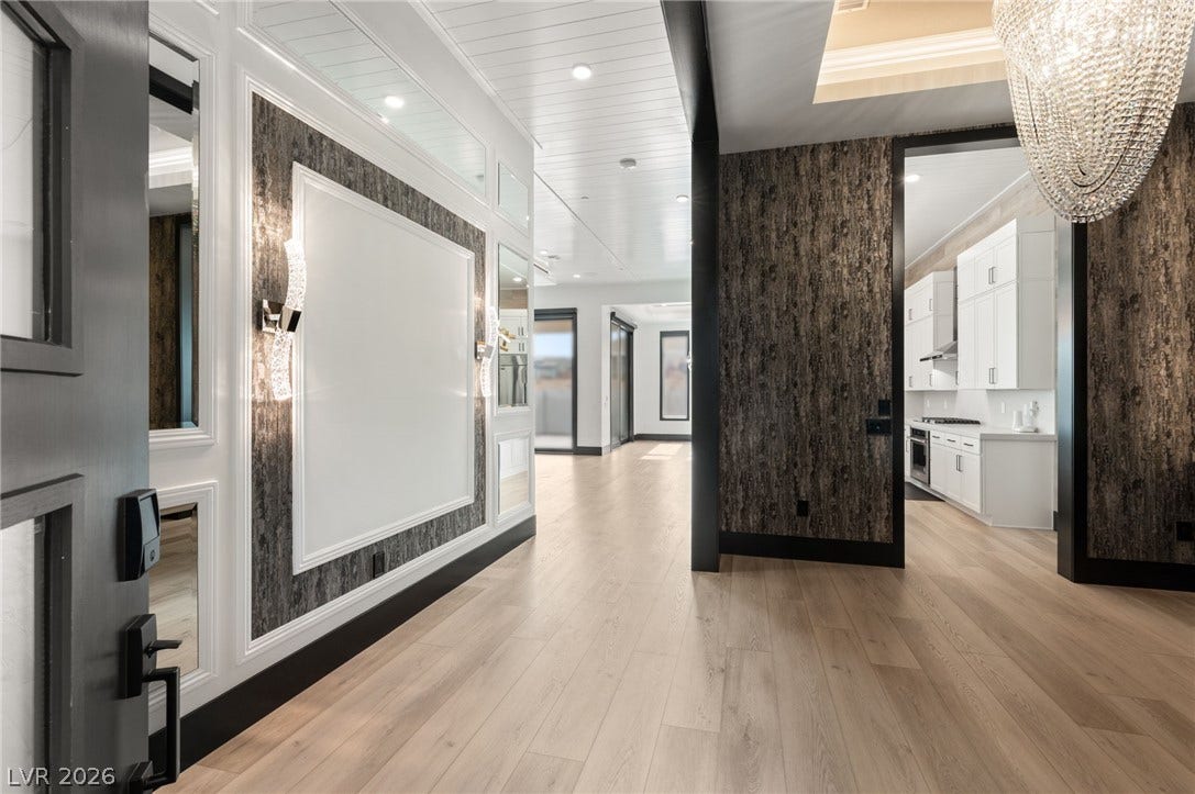 11041 Concord Valley Drive, Las Vegas, NV 89135 Gleaming hardwood floors and a statement chandelier welcome guests into this elegant entrance foyer.