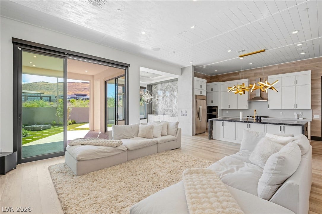 11041 Concord Valley Drive, Las Vegas, NV 89135 Sliding glass doors merge this open-concept space with a scenic mountain backdrop.
