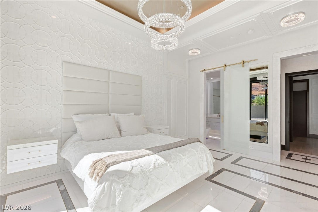 11041 Concord Valley Drive, Las Vegas, NV 89135 Gleaming tile floors and an ornate coffered ceiling elevate this modern main-floor suite.