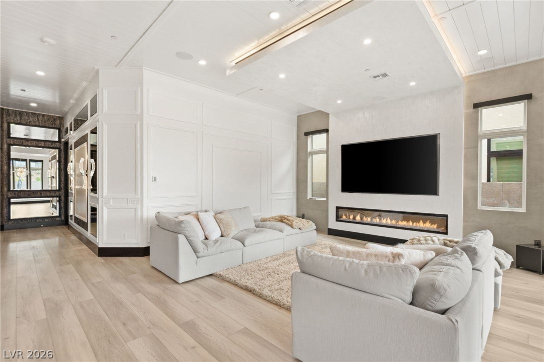 11041 Concord Valley Drive, Las Vegas, NV 89135 Fine woodwork and a sleek linear fireplace define this modern living space.