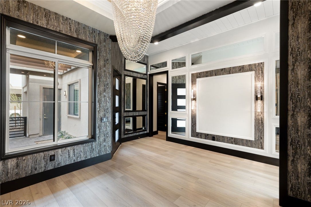 11041 Concord Valley Drive, Las Vegas, NV 89135 Dramatic accent paneling and light wood flooring frame this elegant entry space.