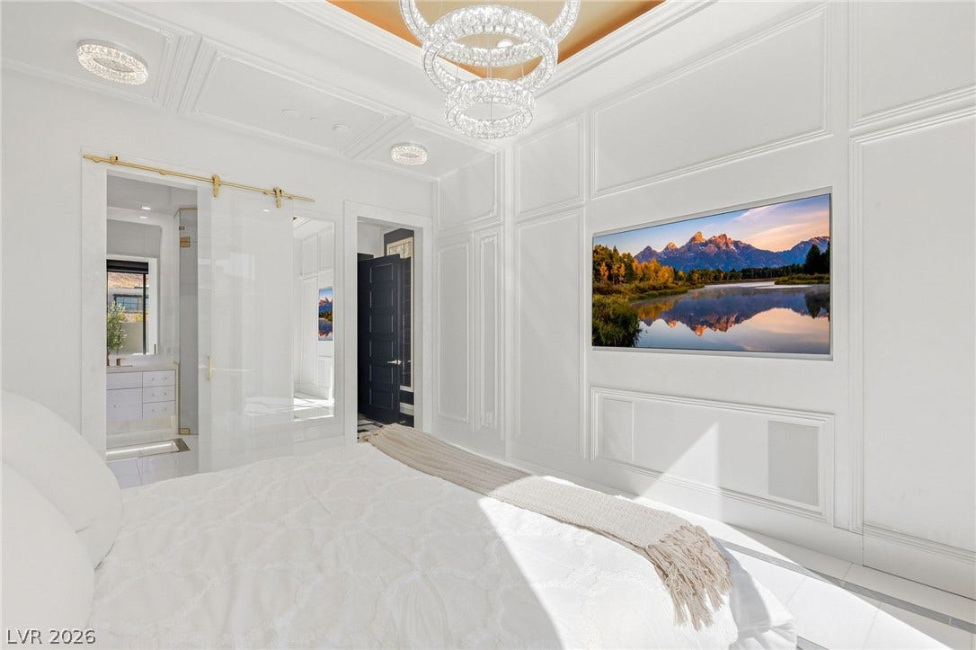 11041 Concord Valley Drive, Las Vegas, NV 89135 Elegant wall molding and recessed ceiling details define this sophisticated bedroom.