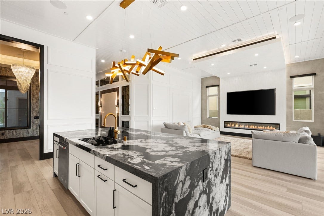 11041 Concord Valley Drive, Las Vegas, NV 89135 Striking stone counters and clean lines define this modern open floorplan layout.