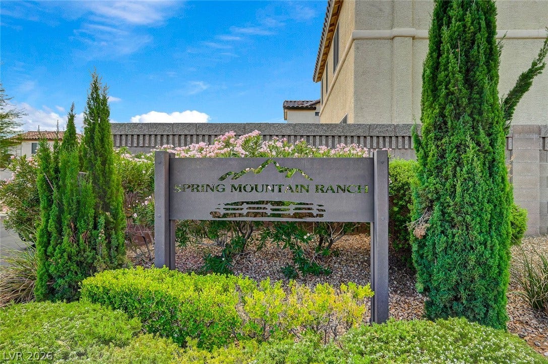 8908 Sheep Ranch Court, Las Vegas, NV 89143 Lush landscaping frames the entry monument sign welcoming residents to the community.