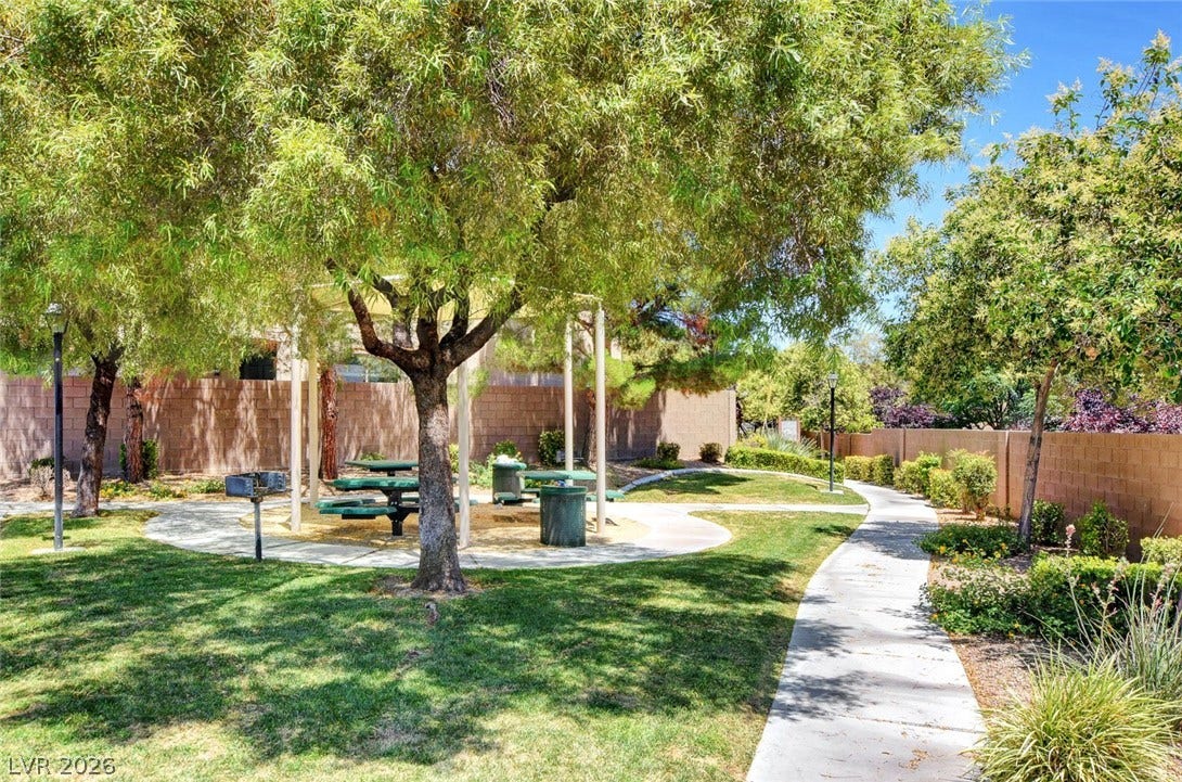 8908 Sheep Ranch Court, Las Vegas, NV 89143 Mature trees shade a quiet community park featuring paved walkways and a picnic area.
