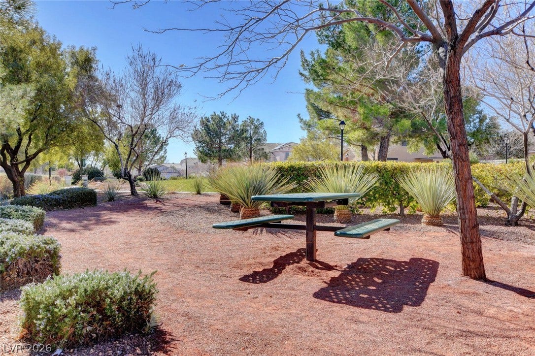 8908 Sheep Ranch Court, Las Vegas, NV 89143 Mature trees shade a quiet outdoor common area complete with neighborhood pathways.