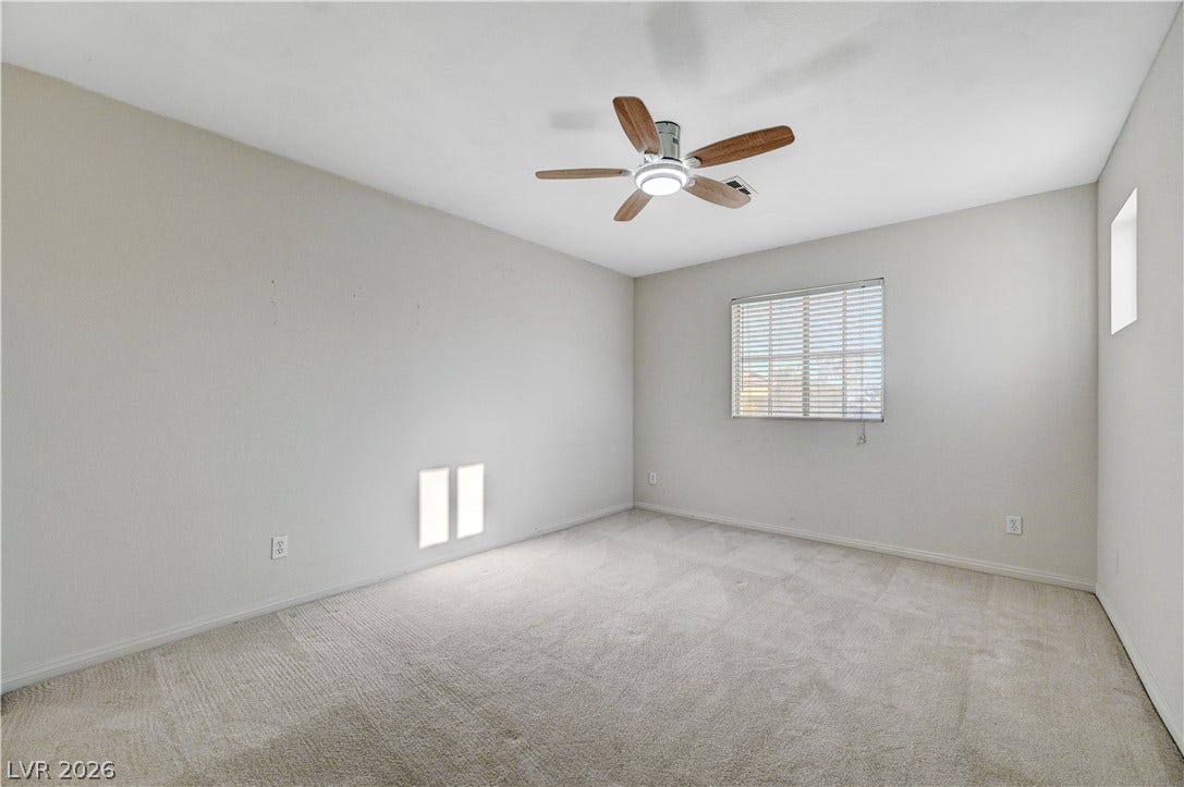 8908 Sheep Ranch Court, Las Vegas, NV 89143 Soft carpeting underfoot defines this versatile bedroom space filled with natural light.