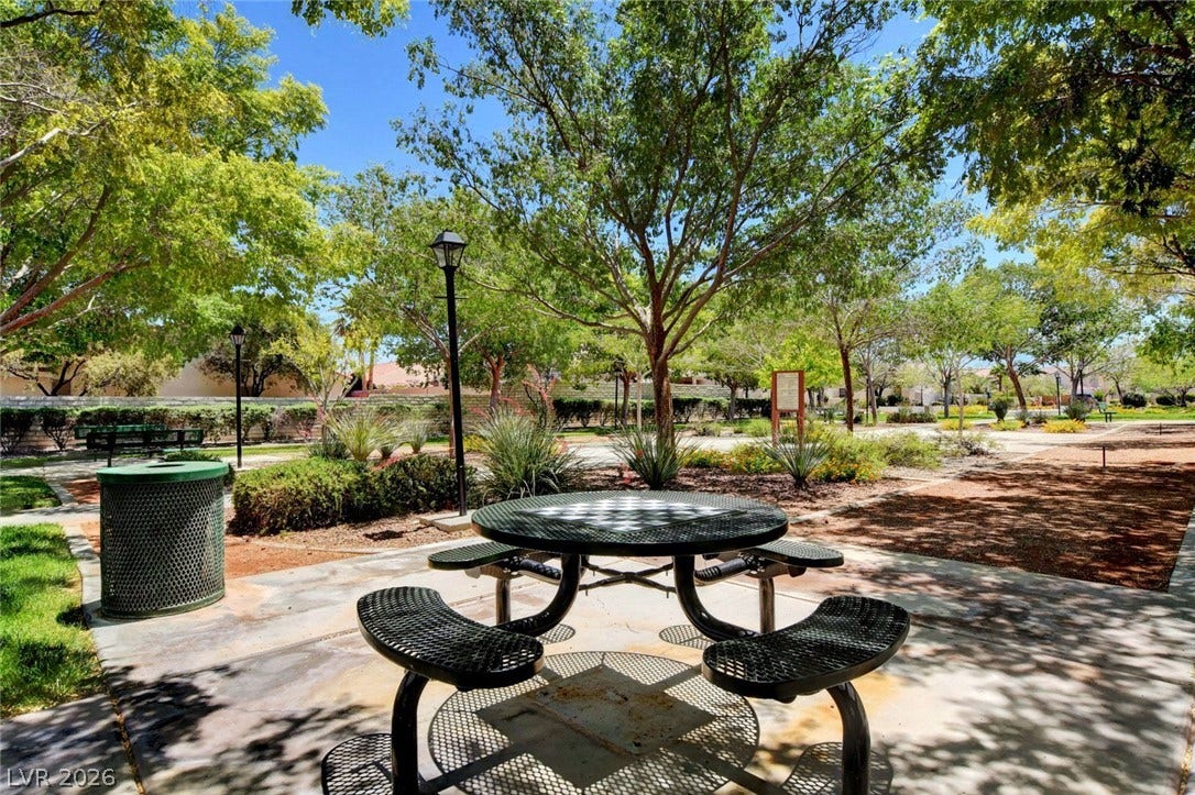 8908 Sheep Ranch Court, Las Vegas, NV 89143 Mature trees shade a welcoming neighborhood park complete with paved walkways and outdoor seating.