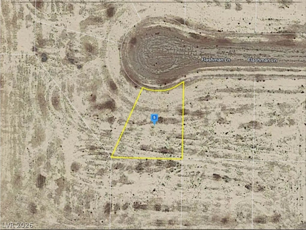 An aerial plat map outlines the parcel boundaries at the end of a quiet cul-de-sac.