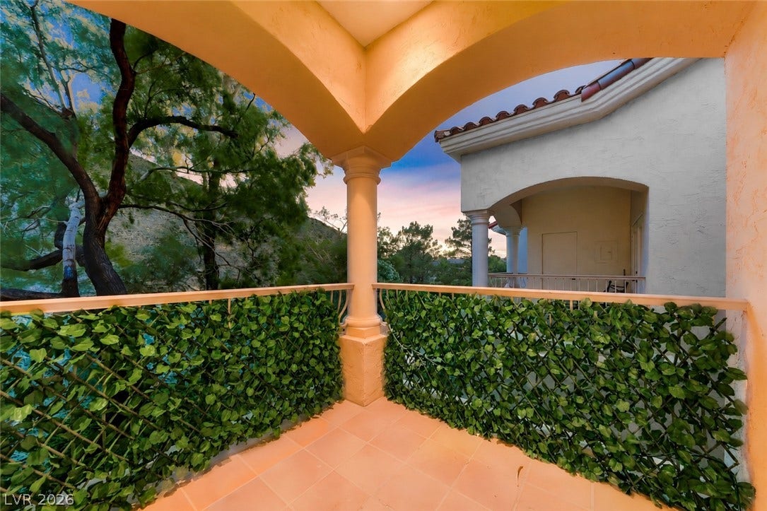 26 Strada Di Circolo, #n/a, Henderson, NV 89011 Tiled flooring and sturdy columns define this covered balcony overlooking peaceful surrounding trees.