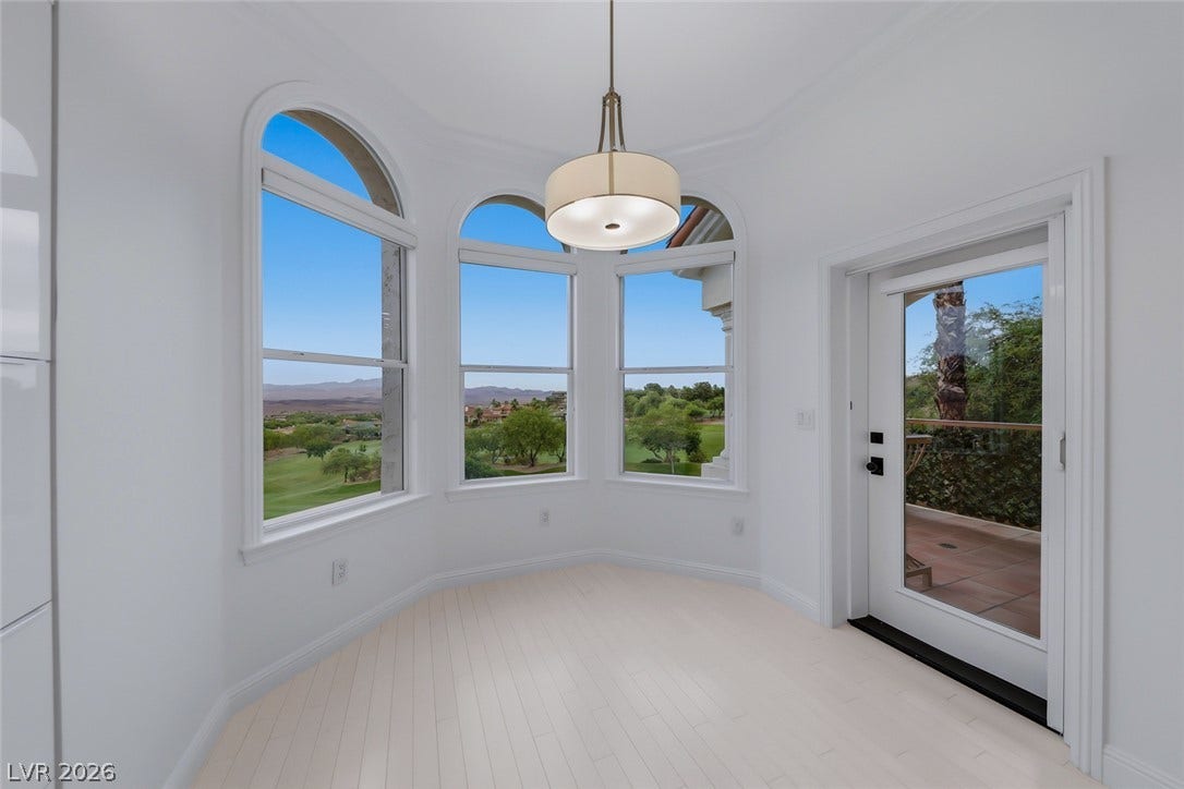 26 Strada Di Circolo, #n/a, Henderson, NV 89011 Arched windows frame sweeping views of the surrounding landscape.